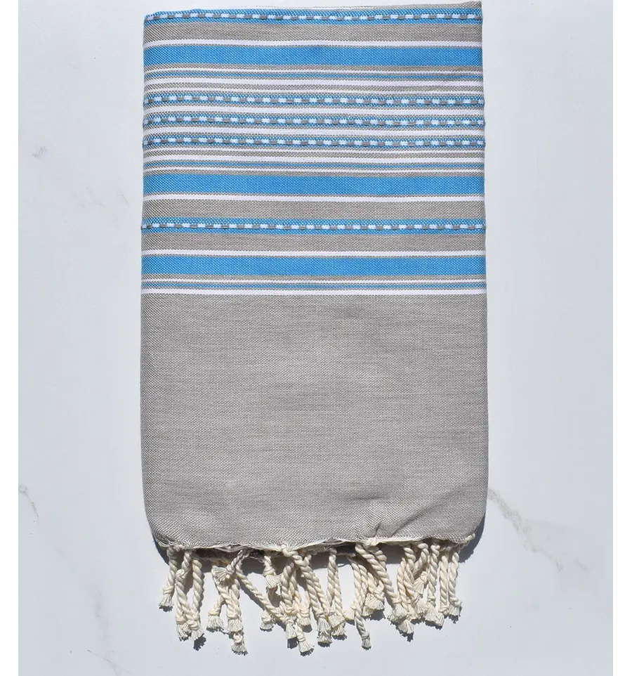 Fouta arabesco de color topo claro con rayas azules 